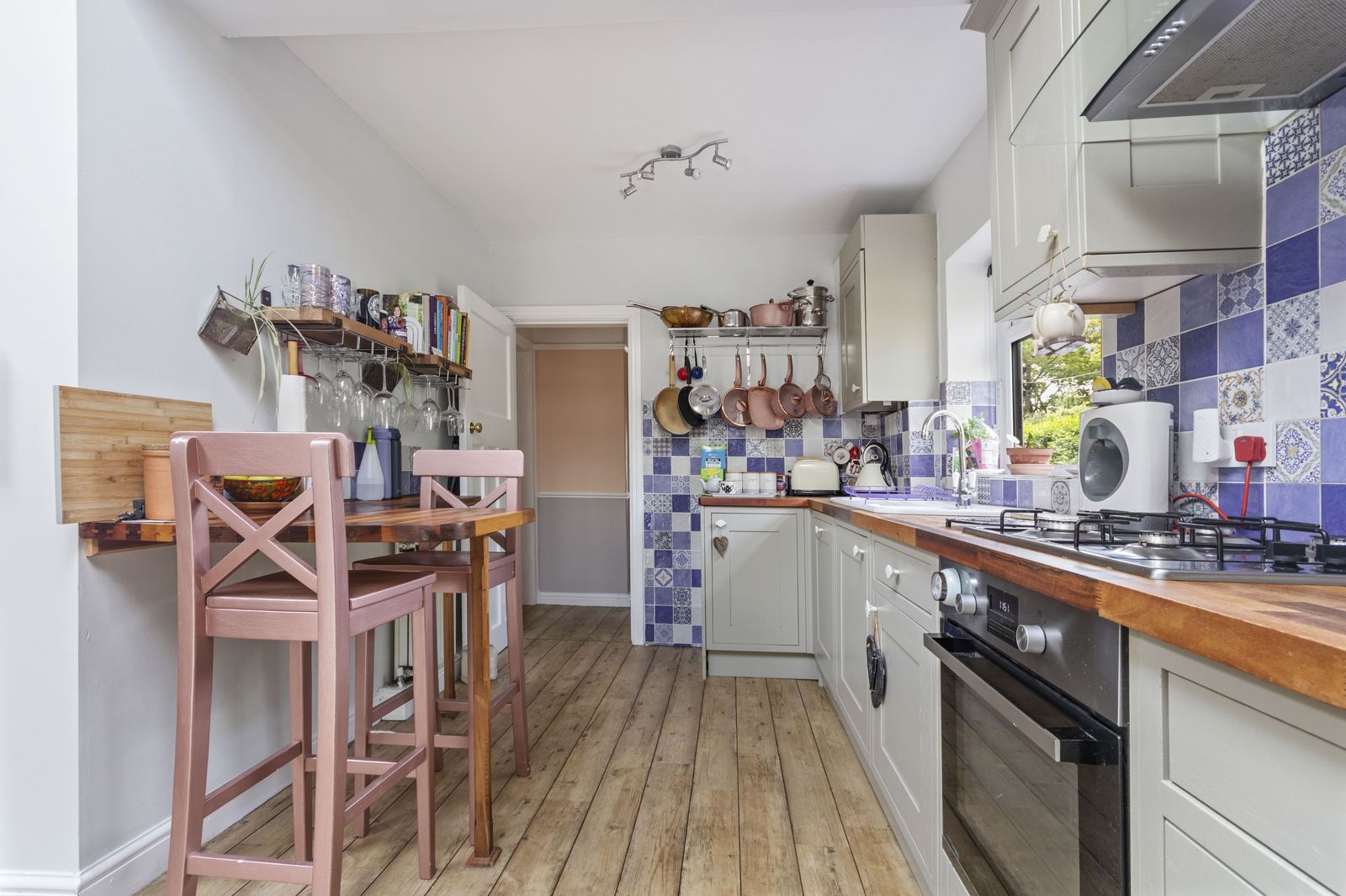 Interior photography of a cottage kitchen with patterned tiles in the Bradford district